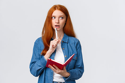 Girl holding a comic book and Pen